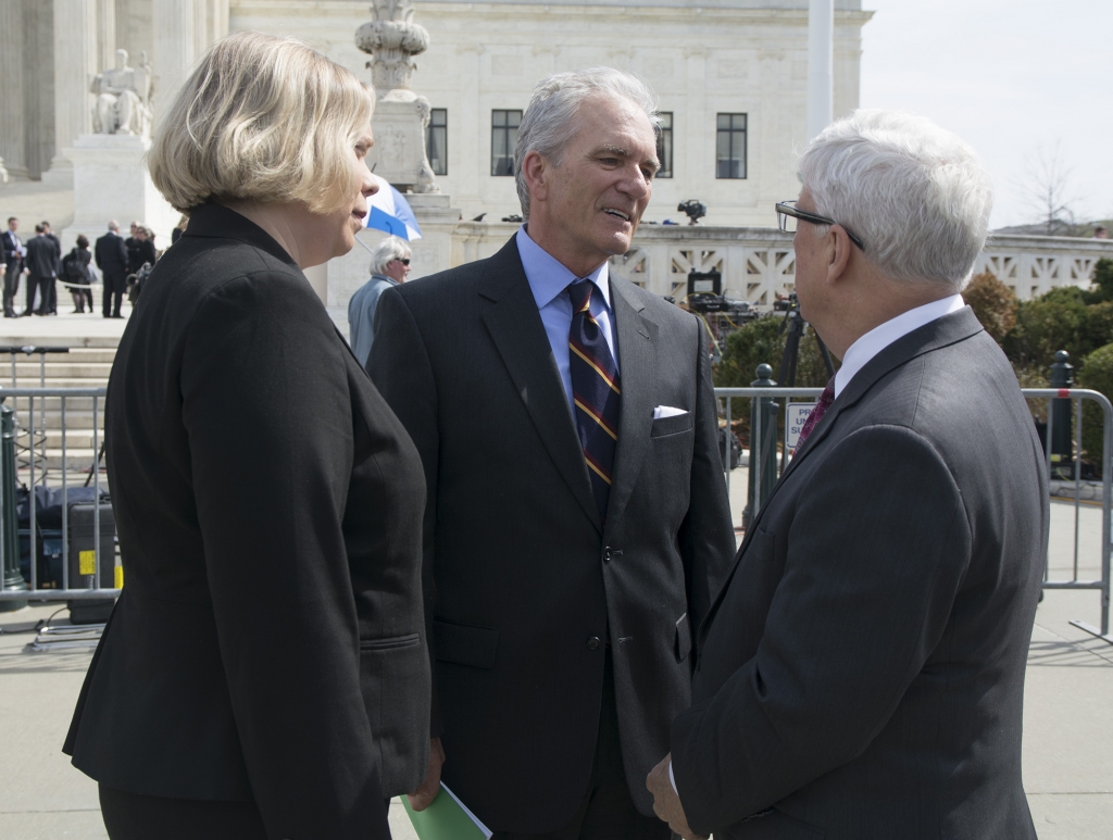 Brent Walker and Jennifer Hawks of the Baptist Joint Committee talk after the hearing with former solicitor general Walter Dellinger