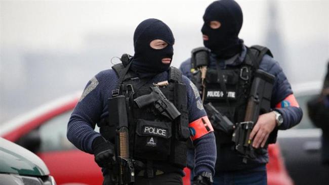 Special police forces stand guard outside the Council Chamber of Brussels