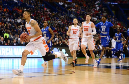 Mar 20 2016 St. Louis MO USA Syracuse Orange forward Michael Gbinije leads the way up court for a shot during the second half of the second round against the Middle Tennessee Blue Raiders in the 2016 NCAA Tournament at Scottrade Center. Syracuse