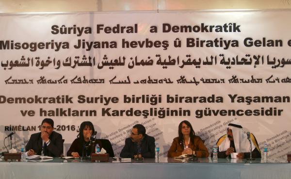 Bureau members of a preparatory conference to announce a federal system discuss a'Democratic Federal System for Rojava- Northern Syria in the Kurdish-controlled town of Rmeilan Hasaka province Syria