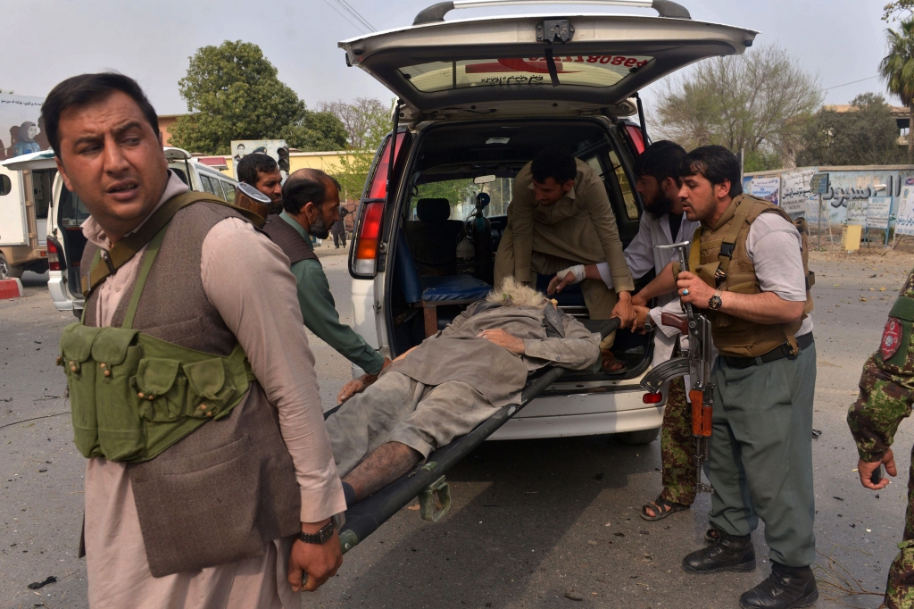 Afghan security forces carry an injured man after a suicide attack on the Indian consulate in the city of Jalalabad east of Kabul Afghanistan. The Afghan Taliban say they will not participate in a peace process