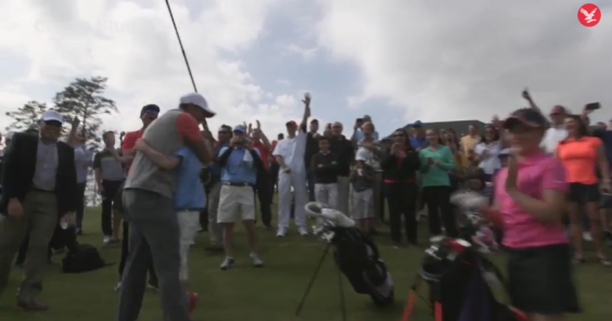 Taylor Crozier celebrates with Tiger Woods after his hole-in-one