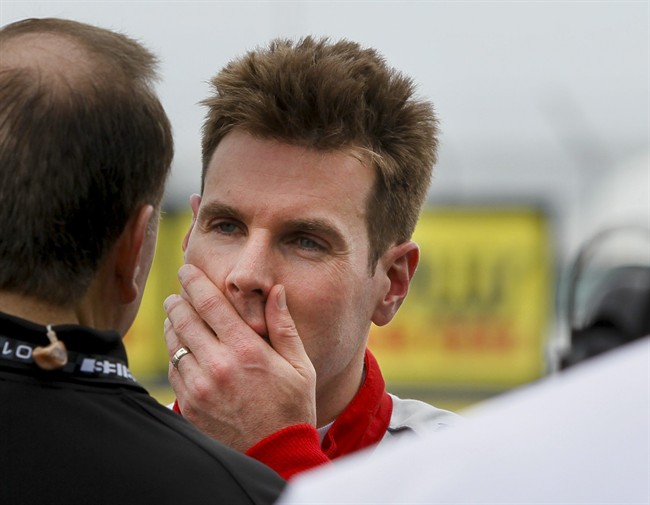 IndyCar driver Will Power who struggled early and hit a wall during a practice session talks while in the pits on opening day of the IndyCar Firestone Grand Prix of St. Petersburg on Friday