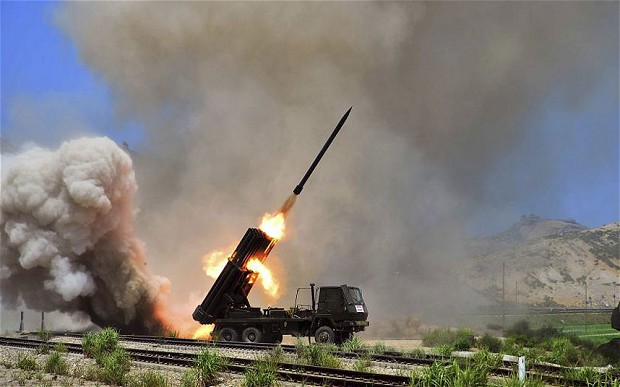 A multiple rocket launcher fires a missile in Pyongyang during an exercise