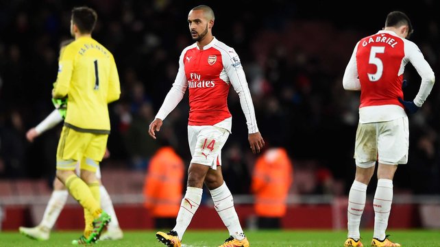 Theo Walcott cuts a disconsolate figure after the loss to Swansea