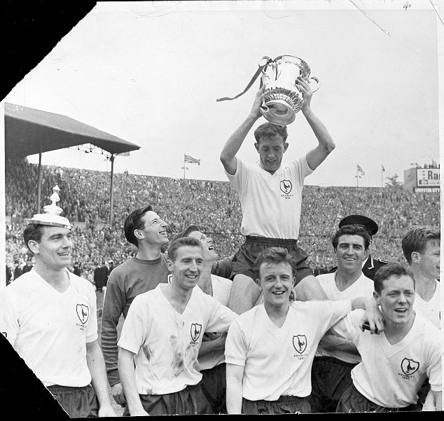 Tottenham's Danny Blanchflower holds the FA Cup aloft after beating Leicester City in the 1961 final