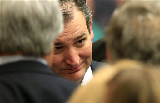 Republican presidential candidate Sen. Ted Cruz R-Texas listens to a supporters at a caucus site Saturday