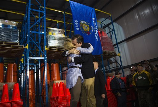 Republican presidential candidate Sen. Ted Cruz R Texas hugs his wife Heidi before speaking at a campaign stop Friday