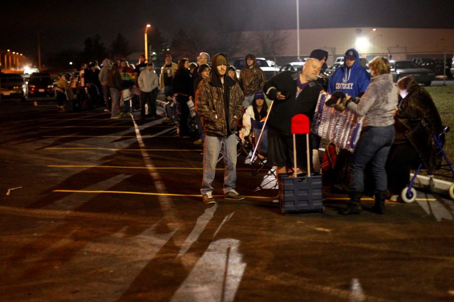 Supporters line up outside of the Wright Brothers Aero Hangar for a rally for Republican presidential candidate businessman Donald Trump early Saturday morning