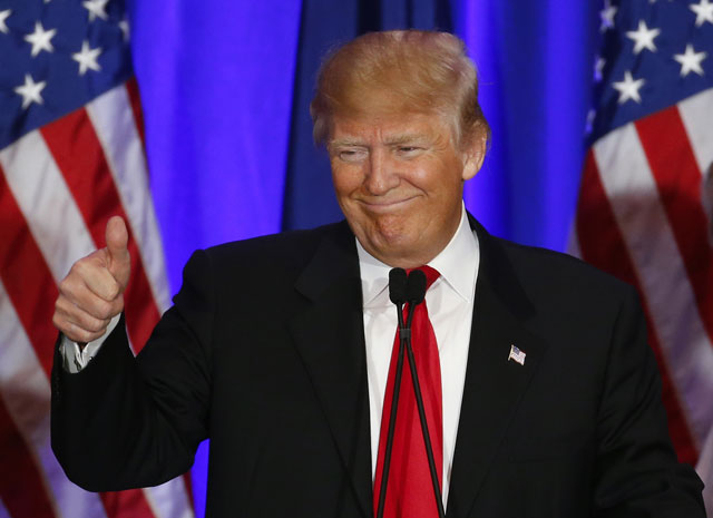 Republican presidential candidate Donald Trump gives a thumbs up during a South Carolina Republican primary night event Saturday Feb. 20 2016 in Spartanburg S.C. Trump is the winner in the South Carolina Republican primary