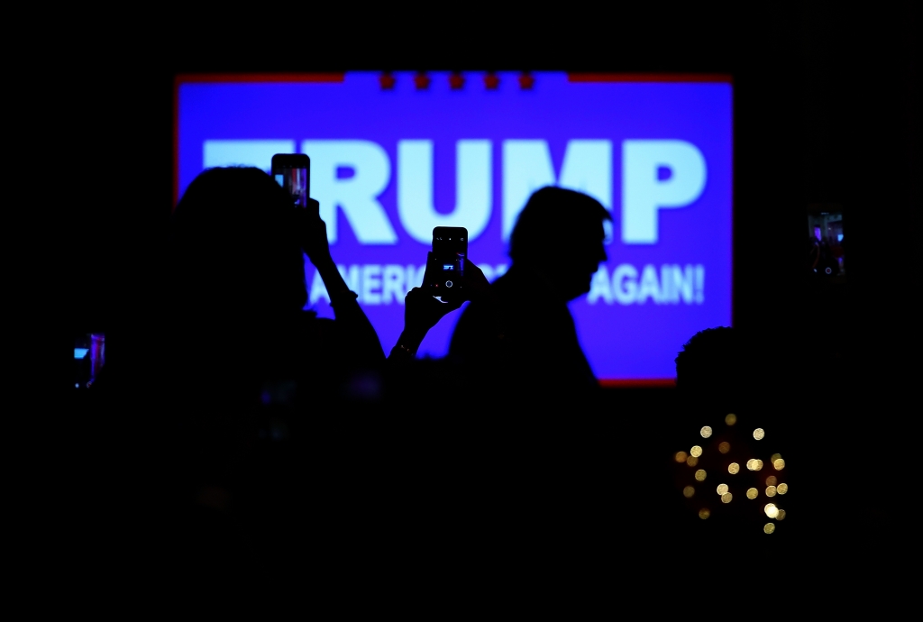 Republican presidential candidate Donald Trump arrives for a primary night press conference at the Mar-A-Lago Club's Donald J. Trump Ballroom