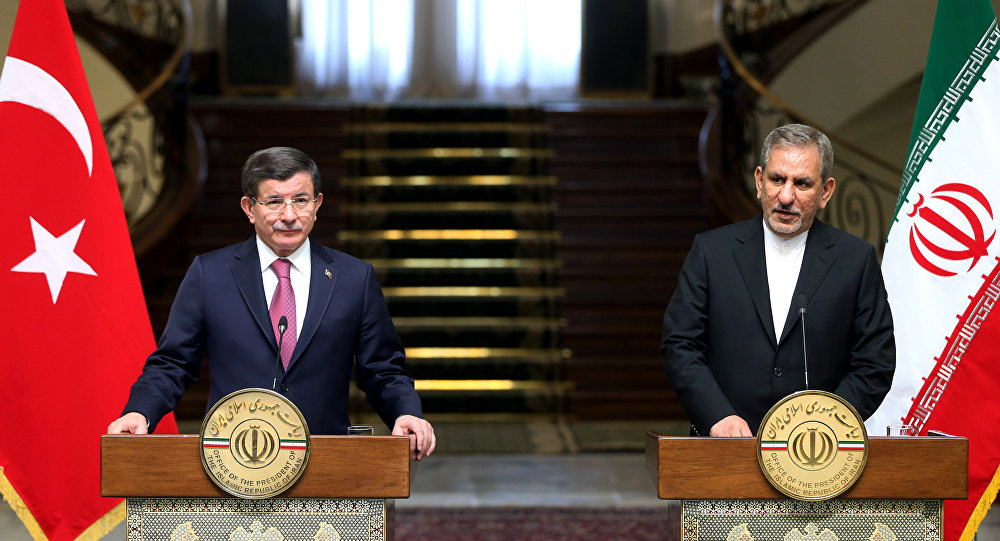 Iranian Vice President Eshagh Jahangiri right speaks with media in a joint press conference with Turkish Prime Minister Ahmet Davutoglu after their meeting at the Saadabad Palace in Tehran Iran Saturday