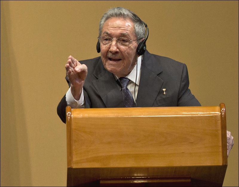 Cuba's President Raul Castro gestures as he speaks during today's press conference