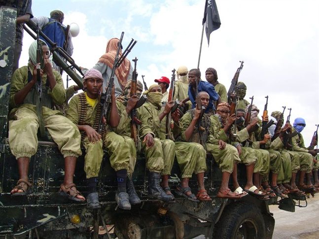 Shabab fighters sit on a truck as they patrol in Mogadishu Somalia. Somalia's intelligence service cooperated with the U.S. in airstrikes that killed more than 150 al Shabab members on Saturday an intelligence