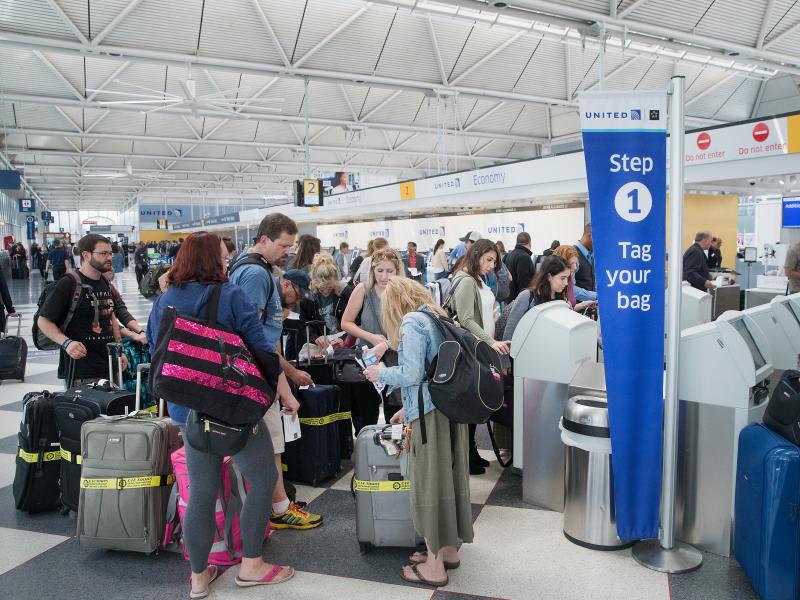 Passengers wait to check in at Chicago's O'Hare Airport in June 2015. TSA screenings at U.S. airports are beyond ticket counters baggage claim and other heavily trafficked areas after terrorist bombings at the Brussels Belgium airport targe