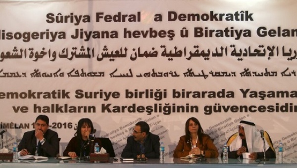 Bureau members of a preparatory conference to announce a federal system discuss a'Democratic Federal System for Rojava- Northern Syria in the Kurdish-controlled town of Rmeilan Hasaka province