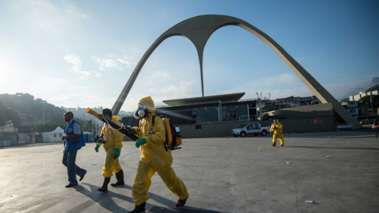 A municipal agent sprays anti Zika mosquito product at the sambadrome in Rio de Janeiro