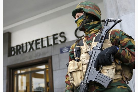 Police control the access to Brussels central train station following Tuesday's bomb attacks