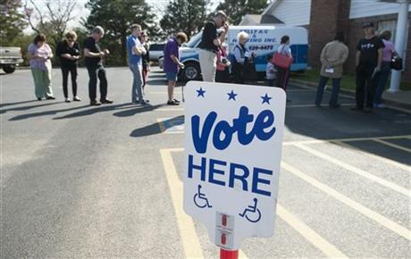 Voters are lined up into parking lot at Flint Baptist Church waiting to vote in the primary election in Flint Texas Tuesday afterno