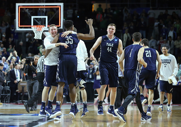 PROVIDENCE RI- MARCH 17 The Yale Bulldogs celebrate defeating the Baylor Bears 79-75 during the first round of the 2016 NCAA Men's Basketball Tournament at Dunkin&#039 Donuts Center