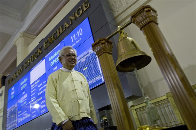 Serge Pun executive chairman of First Myanmar Investment walks as electronic trading commences during the opening day of trading at Yangon Stock Exchange in Yangon Myanmar Friday