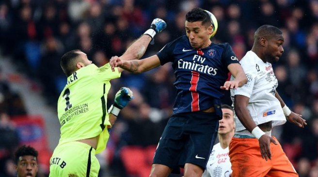 Paris Saint-Germain's defender Marquinhos, Montpellier's goalkeeper Laurent Pionnier and defender William Remy jump for the ball during the French L1 football match