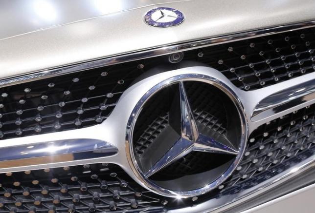 A Mercedes Benz logo is seen on a car displayed on media day at the Paris Mondial de l'Automobile