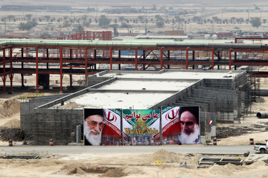 A huge banner bearing portraits of Iran