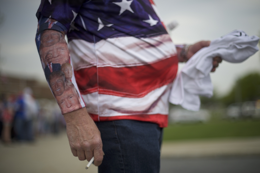 Chris Wolfersberger 62 smokes a cigarette with Donald Trump themed socks worn on his forearms before the Republican presidential hopeful holds a campaign rally at the Pennsylvania Farm Show Complex & Expo Center