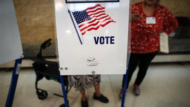 A woman casts her vote at a polling station in Brooklyn in the presidential primary for the state of New York