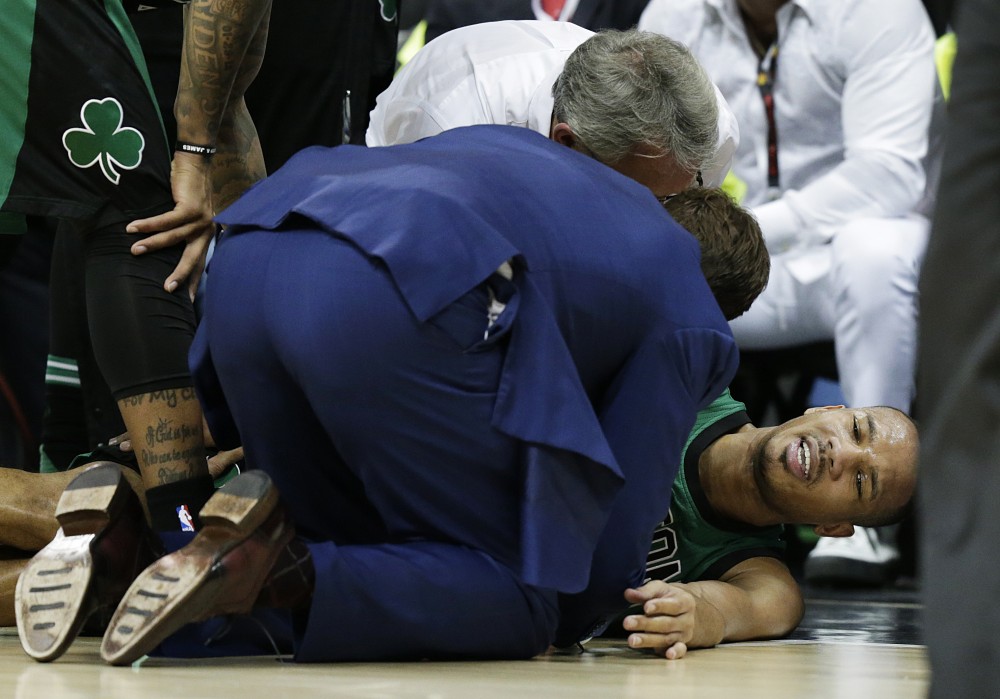 Boston Celtics&#039 Avery Bradley lays on the court after getting injured in the fourth quarter in Game 1 of a first-round NBA basketball playoff series against the Atlanta Hawks Saturday