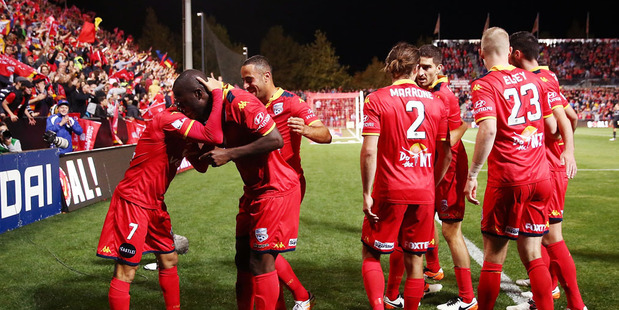 Adelaide players celebrate at the end of the A League Semi Final match between Adelaide United and Melbourne City