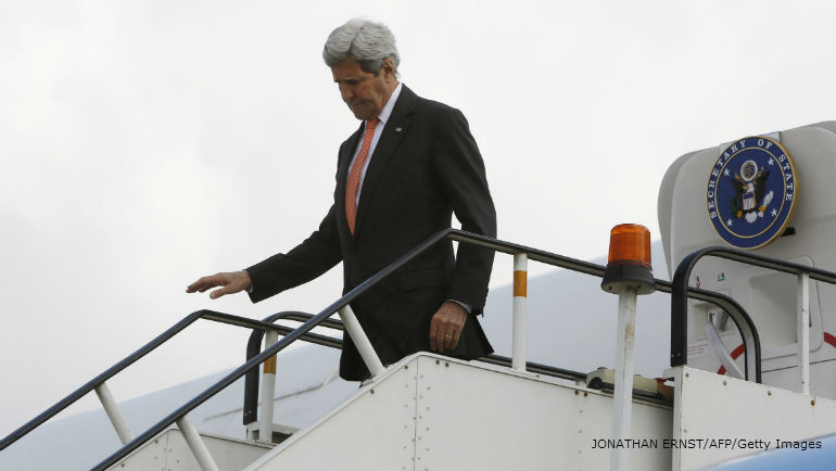 U.S. Secretary of State John Kerry disembarks from his aircraft after arriving at Kabul International Airport in Kabul