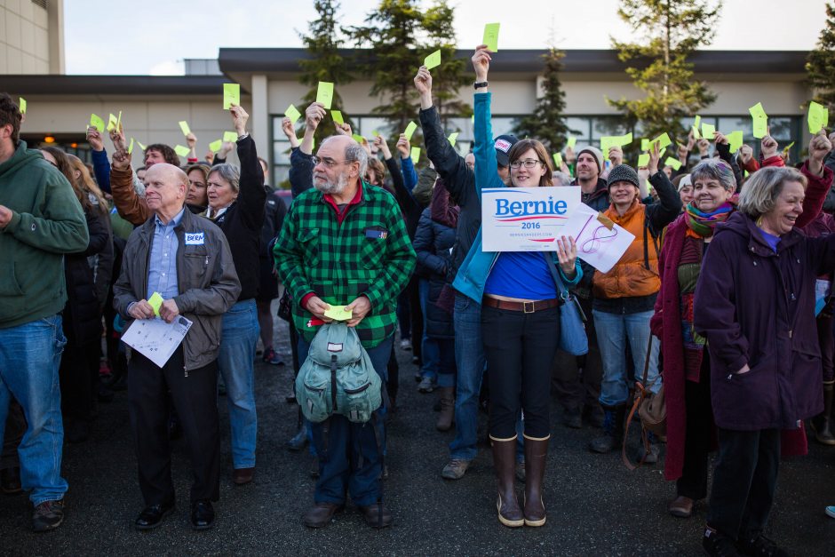 Alaska Democrats including sign holder Danielle Best caucus for Bernie Sanders in the parking lot of West High School on Mar. 26.      Loren Holmes  ADN