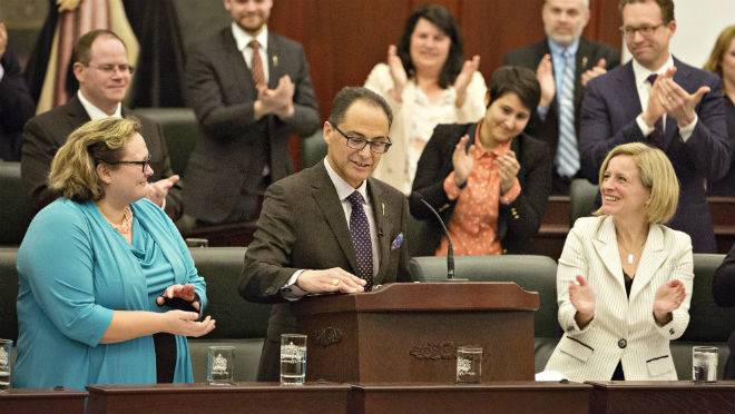 Alberta Minister of Finance Joe Ceci is applauded as he delivers the 2016 budget in Edmonton on Thursday