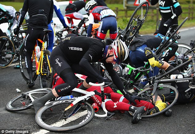 Andrew Tennant of Team Wiggins and Great Britain is involved in a crash during the first stage on Friday