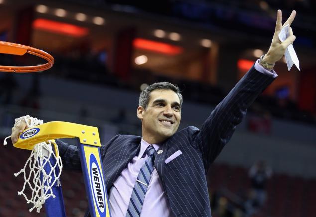 Villanova coach Jay Wright cuts down the nets after his team’s win