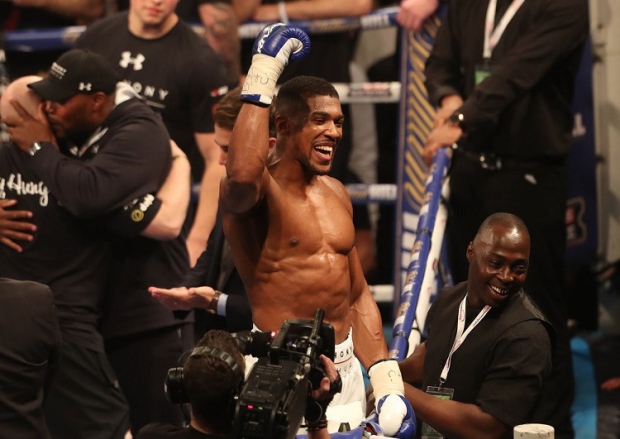 Anthony Joshua celebrates victory over Charles Martin