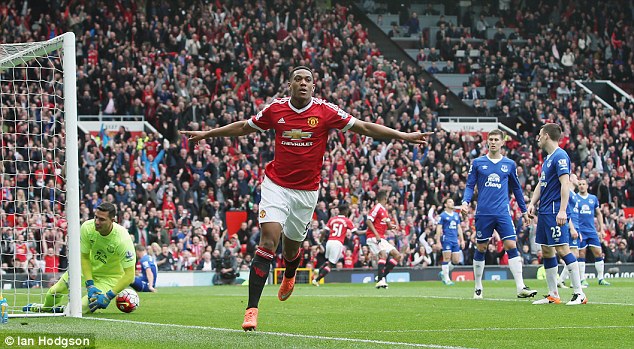 Anthony Martial wheels away in celebration after opening the scoring for Manchester United