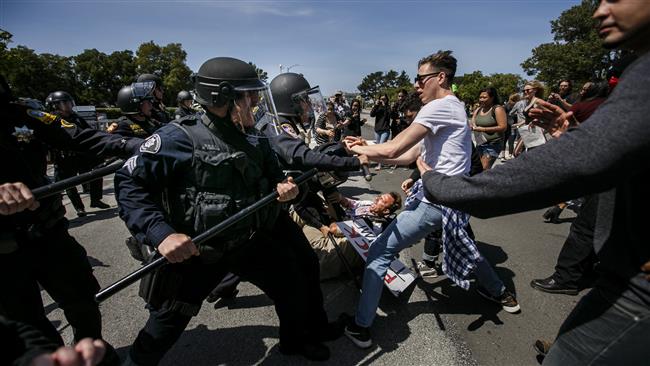 Anti-Trump protesters clash with police outside the California Republican Convention in Burlingame California