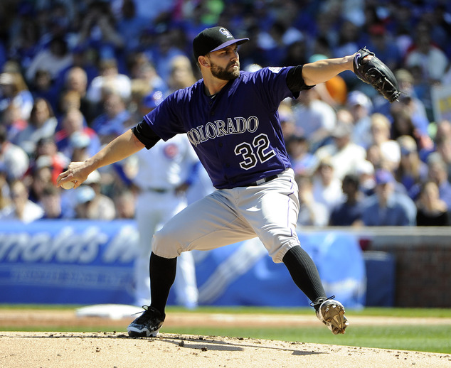 Colorado Rockies starting pitcher Tyler Chatwood throws against the Chicago Cubs during the first inning of a baseball game Sunday