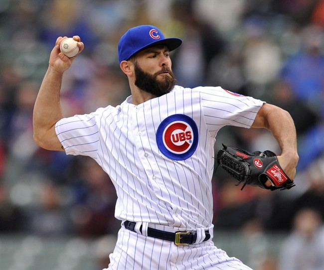 Chicago Cubs starter Jake Arrieta delivers a pitch during the first inning of a baseball game against the Milwaukee Brewers Thursday