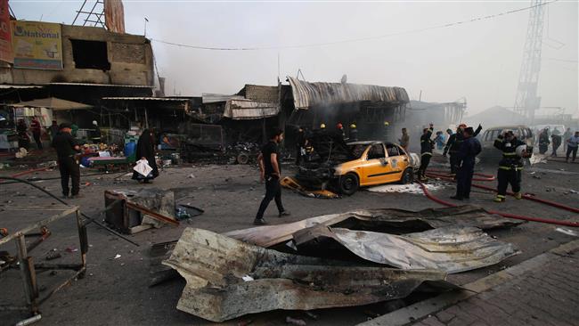 Iraqi security forces and emergency personnel gather at the site of a bomb attack in Baghdad’s eastern district of Baghdad al-Jidida Iraq