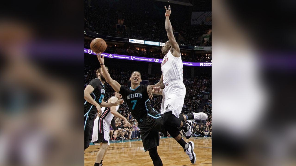 Charlotte Hornets Jeremy Lin shoots over Miami Heats Tyler Johnson during the first half of an NBA first round playoff basketball game in Charlotte N.C