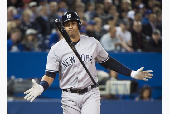 New York Yankees designated hitter Alex Rodriguez reacts after striking out against J.A. Happ. Rodriguez went 0-for-4 with two strikeouts in the loss to the Jays