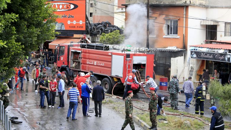 Lebanese army and Red Cross members inspect a damaged area after an explosion that killed Fathi Zaydan a Fatah official responsible for the Palestinian camp of Mieh Mieh in Sidon April 12. REUTERS  Ali Hashisho