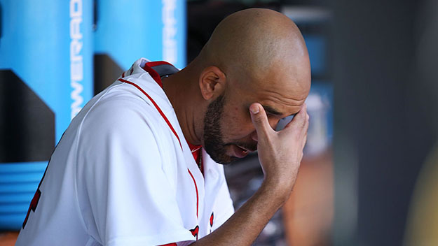 David Price of the Boston Red Sox sits in the dugout after being pulled in the fourth inning against the Tampa Bay Rays