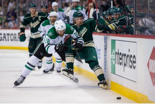 Stars defenseman Stephen Johns and Wild forward Mikael Granlund collide along the boards in the second period of Game 4