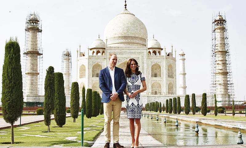 Britain's Prince William and his wife Catherine the Duchess of Cambridge pose at the Taj Mahal in Agra.-Reuters