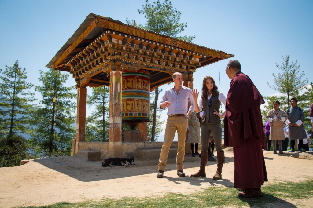 Prince William Duke of Cambridge and Catherine Duchess of Cambridge chat to a monk on the trek up to Tiger's Nest during a visit to Bhutan on the